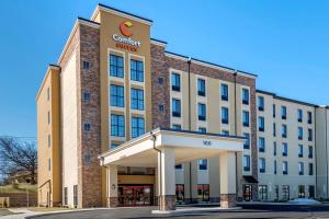 a building with a sign on the front of it at Comfort Suites Camp Hill-Harrisburg West in Harrisburg
