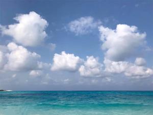 a view of the ocean with a blue sky and clouds at شاليهات بورتو مطروح فيو بحر Porto Matrouh Sea View Families Only in Marsa Matruh