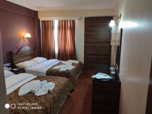 Postel nebo postele na pokoji v ubytování Hotel Bazaar