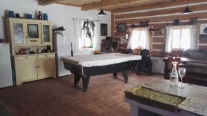 a room with a piano in the middle of a room at Farma Hermína in Jilemnice