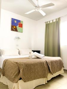 מיטה או מיטות בחדר ב-Hotel Artico