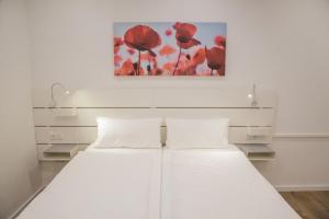 Postel nebo postele na pokoji v ubytování Main Motel