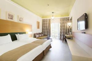 Postel nebo postele na pokoji v ubytování Hotel Riu Tikida Palmeraie - All Inclusive