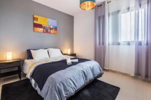 Łóżko lub łóżka w pokoju w obiekcie Candelaria Relax