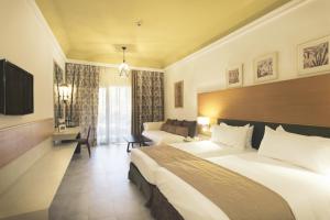 Postel nebo postele na pokoji v ubytování Hotel Riu Tikida Palmeraie - All Inclusive