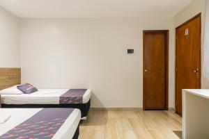 Mega Aeroporto Hotel Apenas 1 km de distância do Aeroporto de Fortaleza客房内的一张或多张床位
