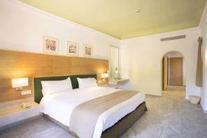 Postel nebo postele na pokoji v ubytování Hotel Riu Tikida Palmeraie - All Inclusive