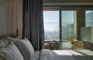 Posteľ alebo postele v izbe v ubytovaní ONOMA Hotel