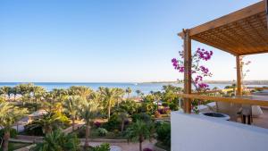 a view of the beach from the balcony of a resort at Fort Arabesque Resort, Spa & Villas in Hurghada