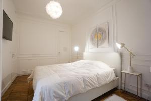 Ліжко або ліжка в номері Modern Duplex Close To The Eiffel Tower