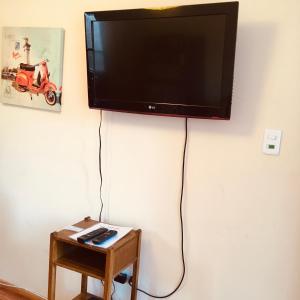 En tv och/eller ett underhållningssystem på Cabaña Vicuña