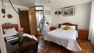 Postel nebo postele na pokoji v ubytování Hostal Comarca Imperial