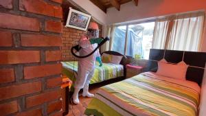 Postel nebo postele na pokoji v ubytování Hostal Comarca Imperial