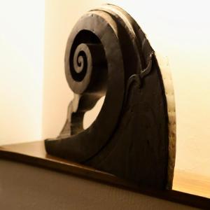 a spiral sculpture on a wooden shelf at Hotel Portofoz in Porto
