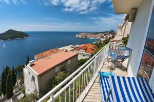 a balcony with a view of a body of water at Sipa Apartments in Dubrovnik