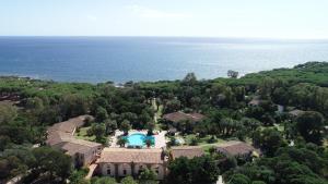 an aerial view of a house with a swimming pool at Hotel Costa dei Fiori in Santa Margherita di Pula