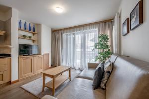 Televízia a/alebo spoločenská miestnosť v ubytovaní Apartment Torri di Seefeld