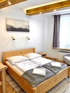Posteľ alebo postele v izbe v ubytovaní APARTAMENTY KRUPÓWKI 35 (Maria Mąka)