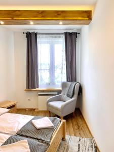 Posteľ alebo postele v izbe v ubytovaní APARTAMENTY KRUPÓWKI 35 (Maria Mąka)