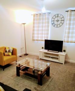 a living room with a tv and a coffee table at Sigma Central Apartment 2 in North Shields