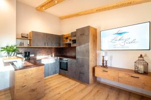 Kuchyň nebo kuchyňský kout v ubytování LakeSide Appartments