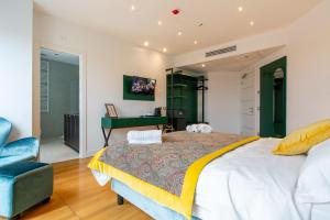 a bedroom with a large bed and a desk at Missori Suites in Milan