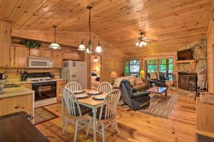 a kitchen and living room with a table and chairs at Pinot and Pine Chic Log Cabin about 5 Mi to Blue Ridge in Blue Ridge