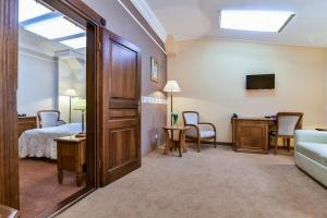 Postel nebo postele na pokoji v ubytování Hotel SPA Wieniawa