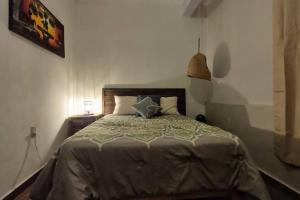 Ein Bett oder Betten in einem Zimmer der Unterkunft Embajadoras Apartment & Rooftop