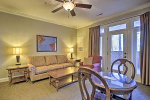 uma sala de estar com um sofá e uma mesa em Resort-Style Condo on Golf Course with Private Pool! em Spring Lake