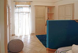 a living room with a bed and a window at Terra e mare in Pantelleria