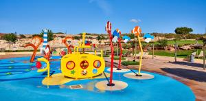a playground in a park with a yellow submarine at Insotel Punta Prima Resort in Punta Prima