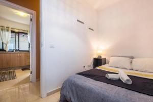 Łóżko lub łóżka w pokoju w obiekcie Candelaria Relax
