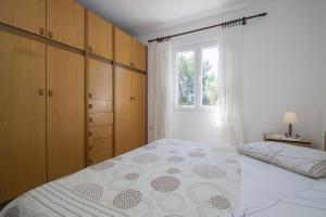Posteľ alebo postele v izbe v ubytovaní Seafront Apartment Dana