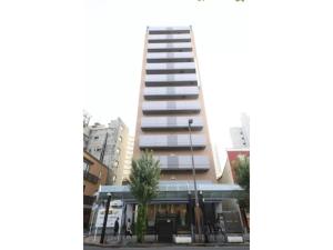 a tall building with a tree in front of it at R & B Hotel Kamata Higashiguchi - Vacation STAY 14841v in Tokyo