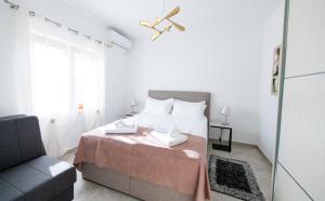 Łóżko lub łóżka w pokoju w obiekcie Bella Apartments Zaton