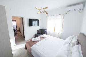 Łóżko lub łóżka w pokoju w obiekcie Bella Apartments Zaton
