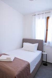 Łóżko lub łóżka w pokoju w obiekcie Bella Apartments Zaton