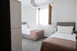Łóżko lub łóżka w pokoju w obiekcie Bella Apartments Zaton