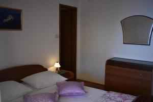 Łóżko lub łóżka w pokoju w obiekcie Rooms Raos