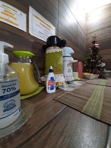 a counter with jars of food and a christmas tree at Pousada Canoas in Pontal do Paraná