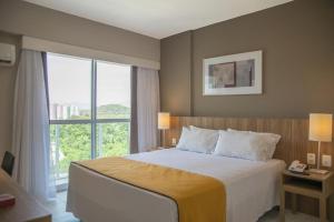 Cama ou camas em um quarto em RioStay Residence - Riocentro