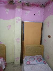 A bed or beds in a room at فندق التمساح