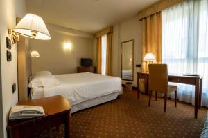Postel nebo postele na pokoji v ubytování La Pieve Hotel + 33 fotografií