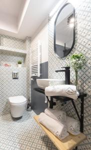 a bathroom with a sink and a toilet and a mirror at Apartament "Nosal" Droga na bystre Zakopane in Zakopane