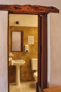 a bathroom with a sink and a toilet at Huaira Huasi in Purmamarca