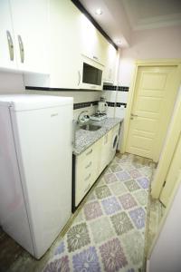 Kuchyň nebo kuchyňský kout v ubytování Bella Suit Apart Hotel