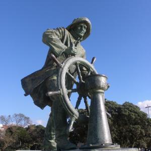 a statue of a man with a wheel at Hotel Portofoz in Porto