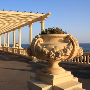 a large vase with flowers in it on a bridge at Hotel Portofoz in Porto