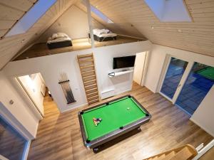 an overhead view of a pool table in a tiny house at 10 person holiday home in Odder in Odder